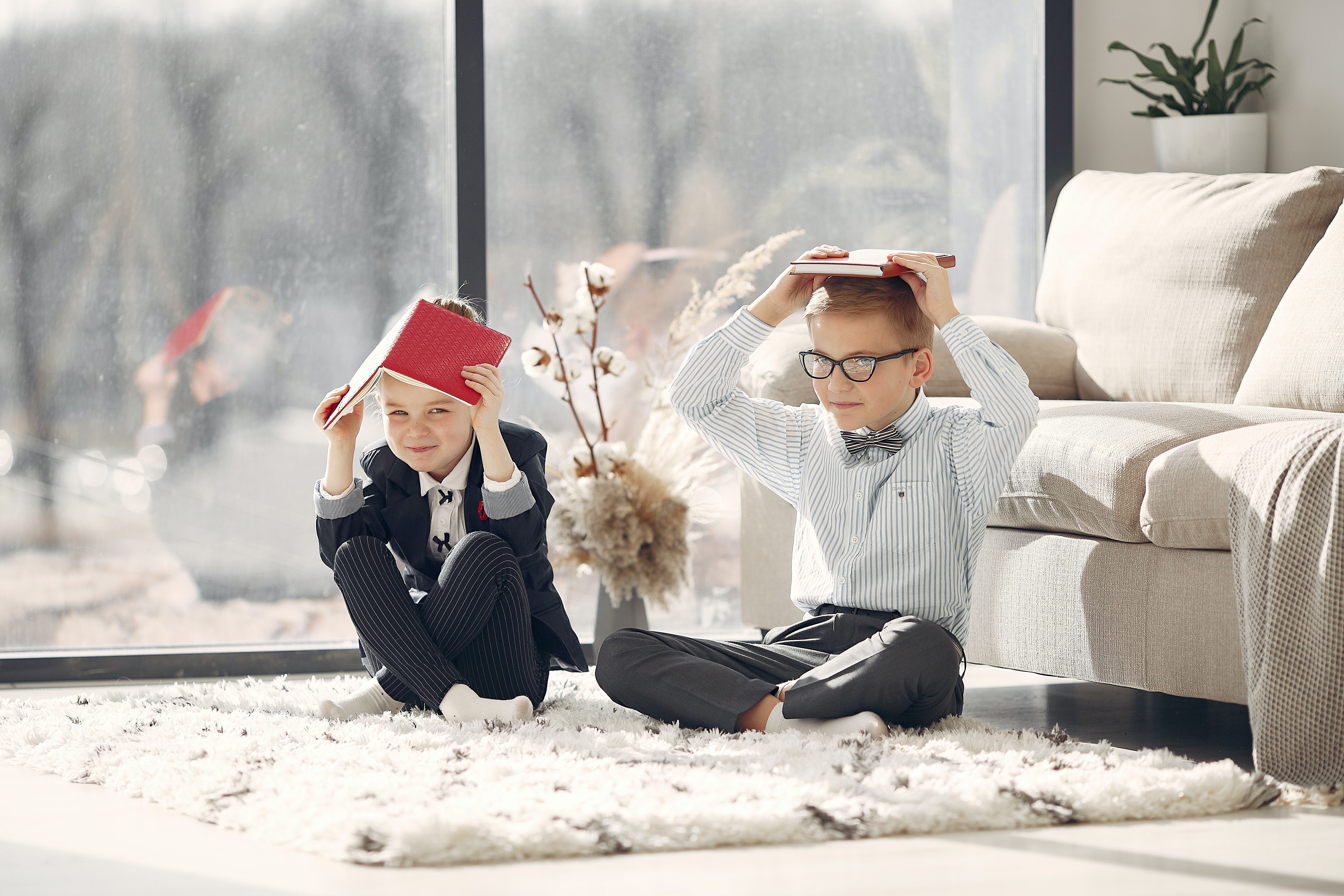 cute-kids-with-textbooks-in-cozy-living-room-on-sunny-day-3874178.jpg