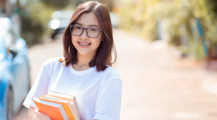 How can misaligned teeth affect a child’s school life?